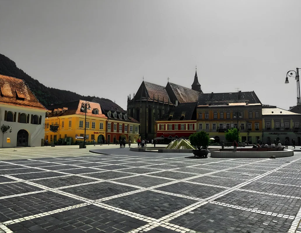 Town square in Brasov with Gothic church and colorful buildings