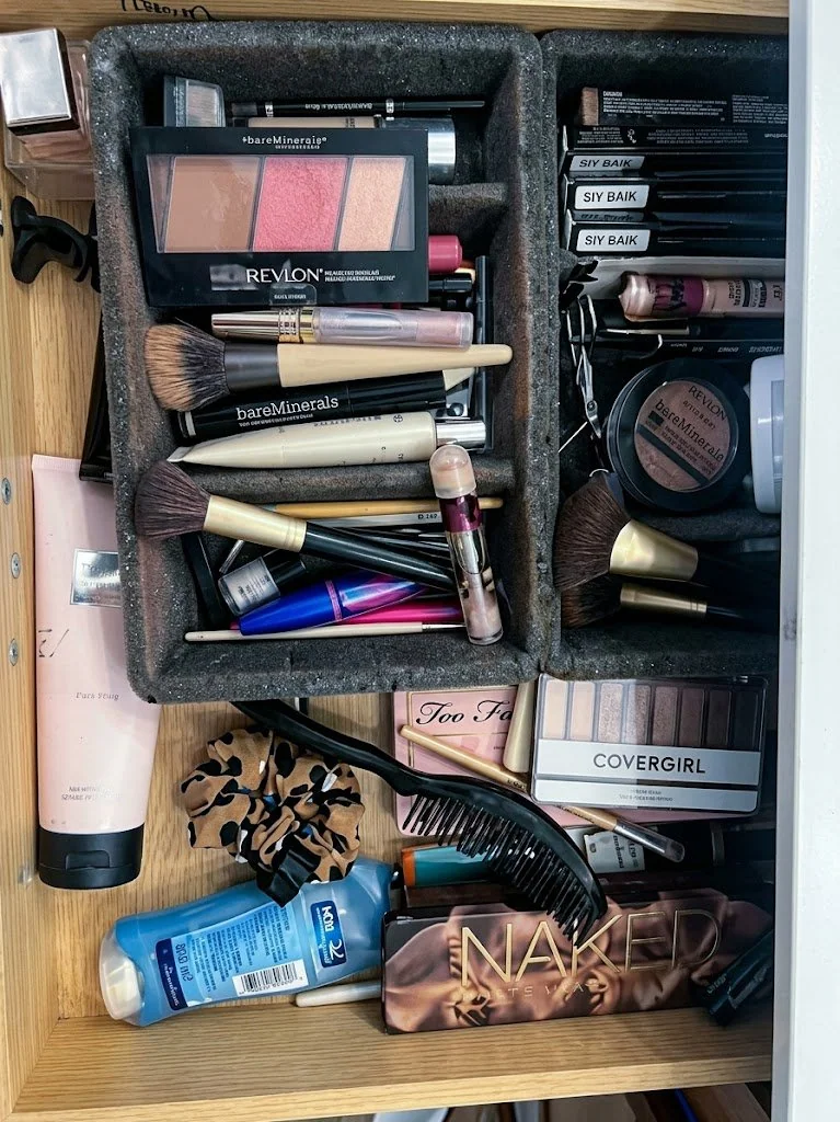 Brushes and products crammed into a makeshift holder