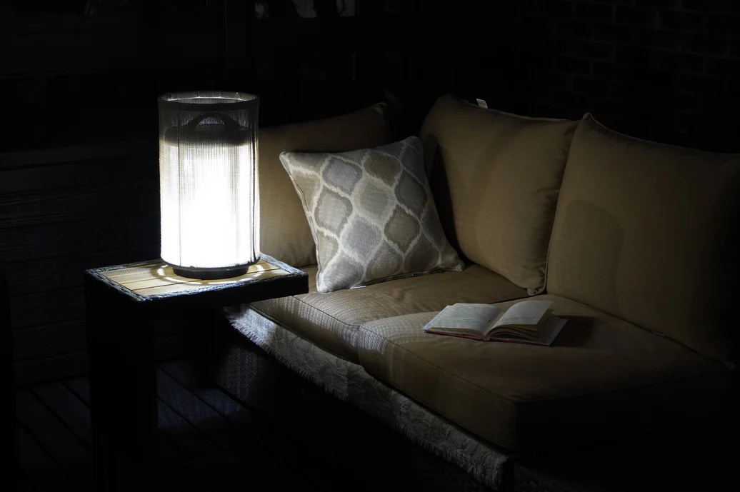 Pelma lamp on a small couch side table