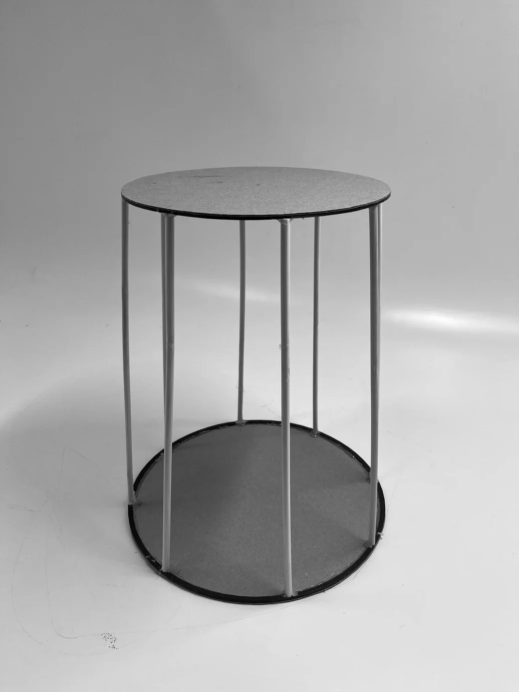 Aluminium frame with wooden top disc — works-like structure before fabric is applied