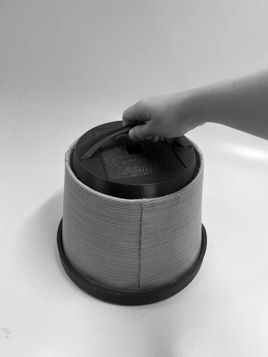 Hand pressing the handle down into the top module — testing the snap mechanism