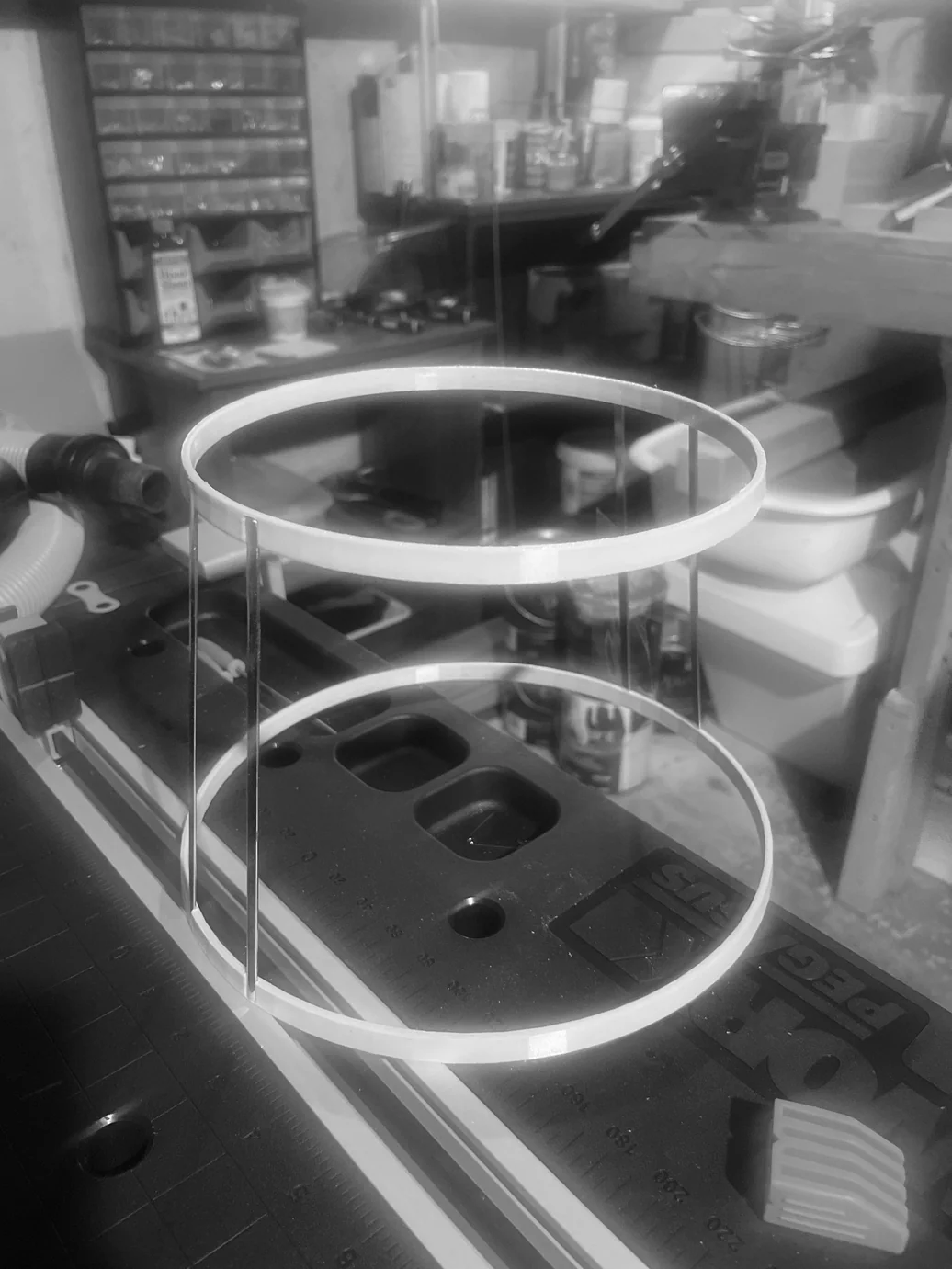 Two LED rings glowing inside an acrylic test rig — validating the light output before final assembly