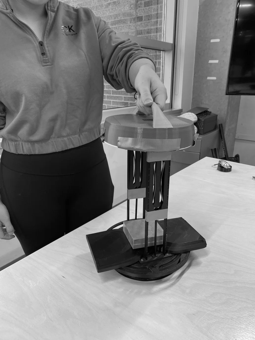 Person operating the spring-steel handle mechanism