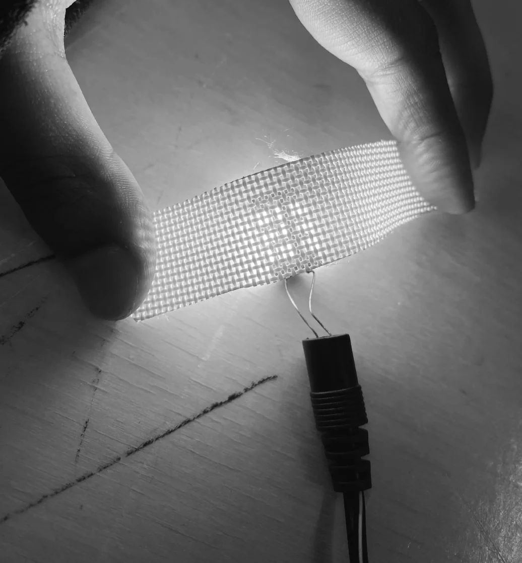 Mesh fabric lit from within by an LED — first diffusion test