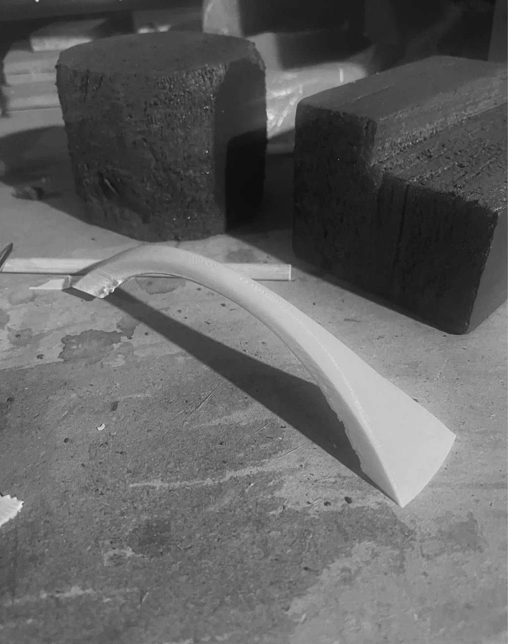 3D-printed handle component — the part that lifts and locks