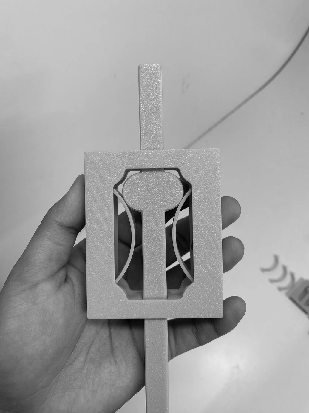 Handle mechanism held in hand — showing raised position