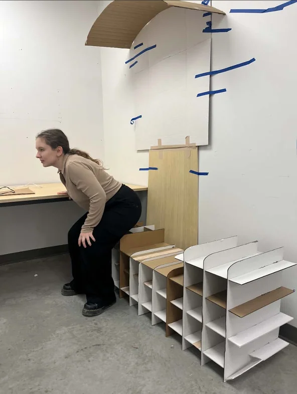 User evaluating ergonomics and spatial quality of the shelter mockup