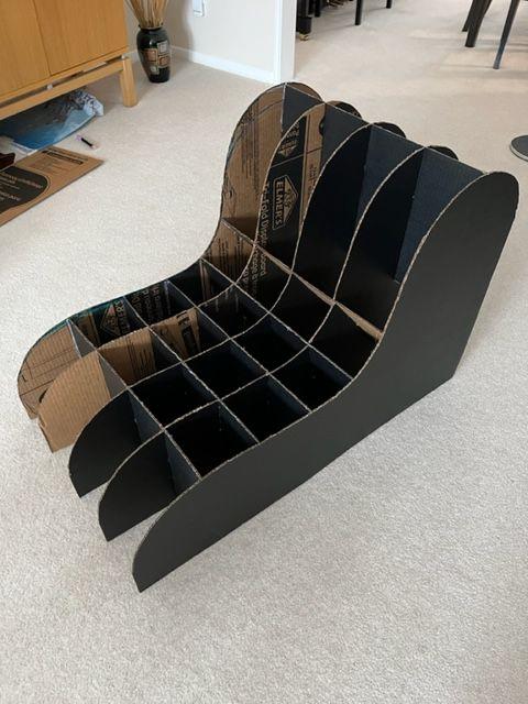 Cardboard divider skeleton forming the chair's seat structure
